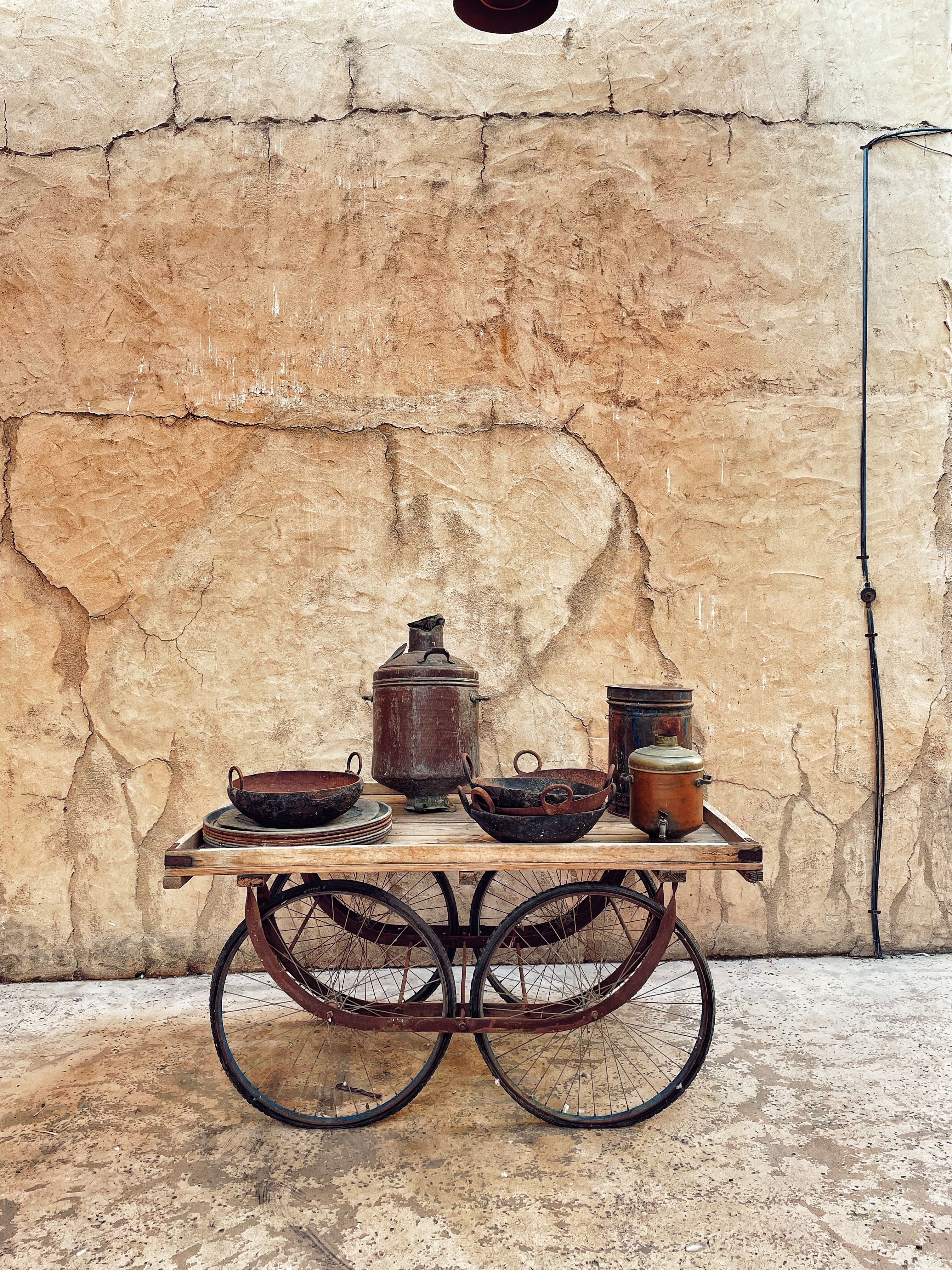 Rustic Table with Antique Cookware Display · Free Stock Photo