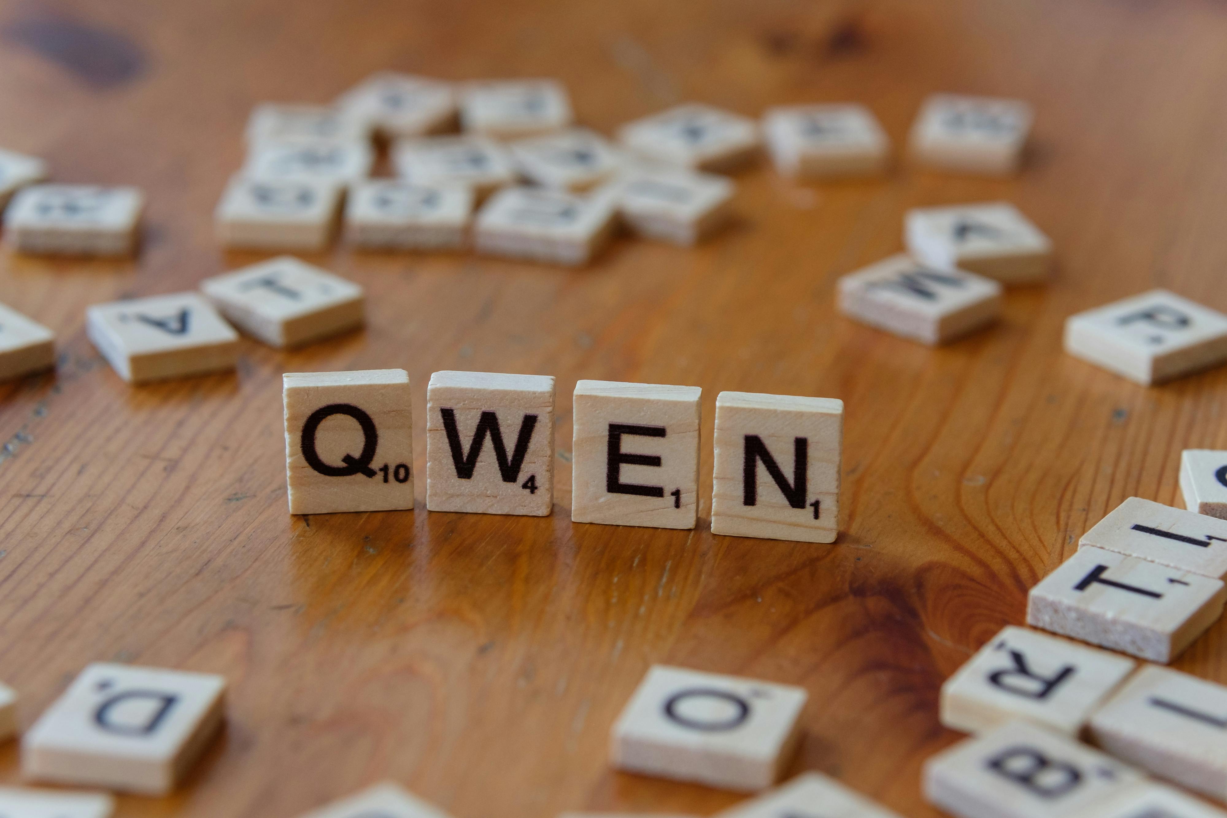 close up of scrabble tiles spelling qwen