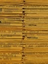 Vintage Stacked Newspapers Close-Up Image
