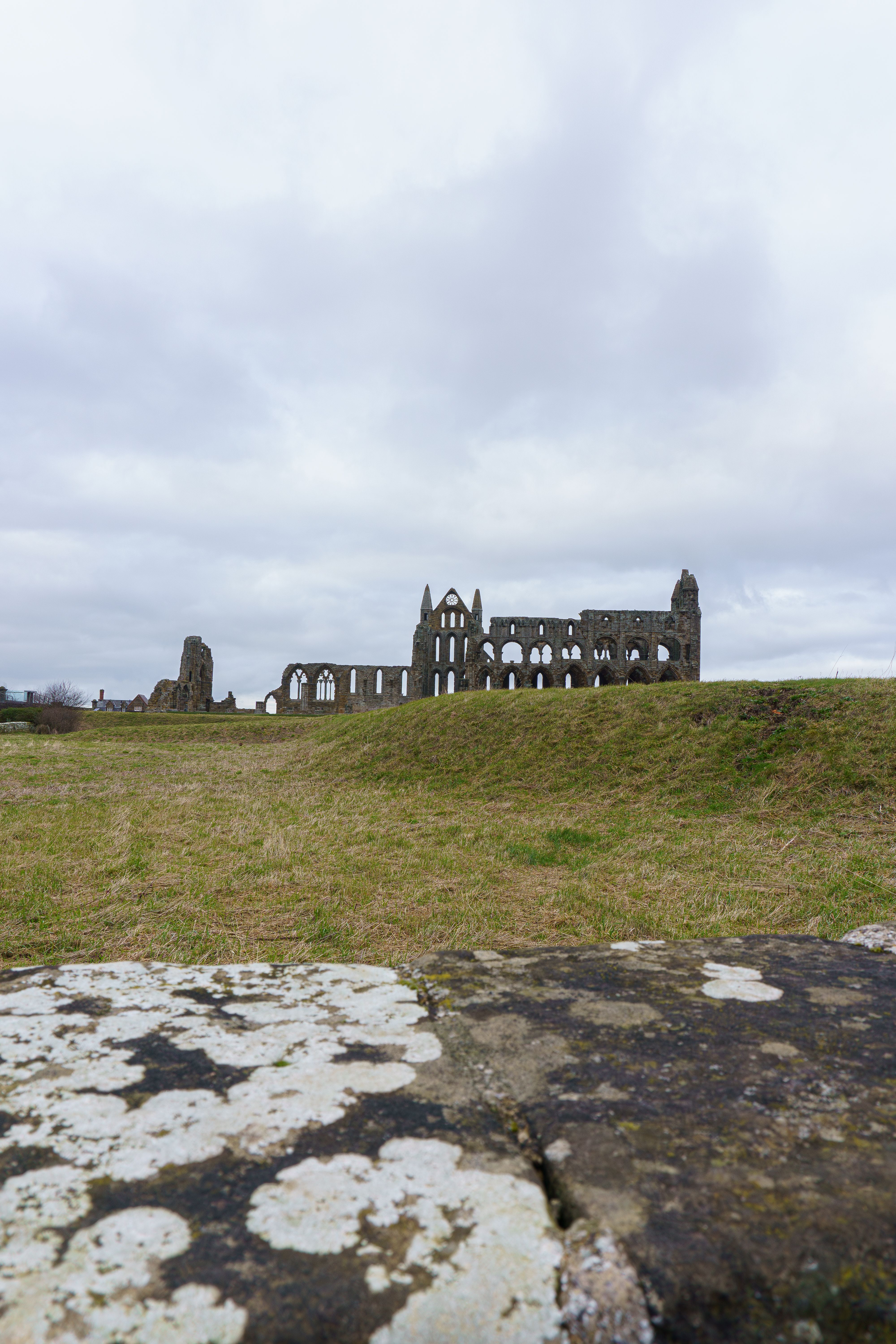 Explore the serene ruins of Whitby Abbey in England. Perfect for historical and architectural themes.