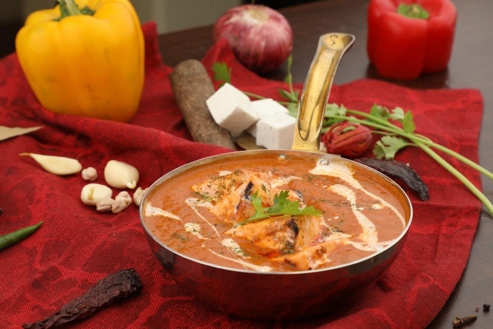 Paneer tikka masala with fresh herbs
