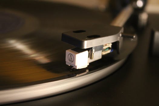Detailed shot of a turntable needle on a spinning vinyl record, conveying a retro vibe.