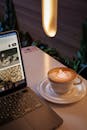 Cozy Workspace with Laptop and Latte Art Coffee