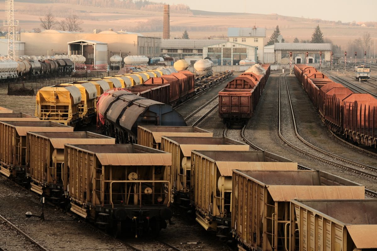 Freight train yard with multiple tracks and rail cars