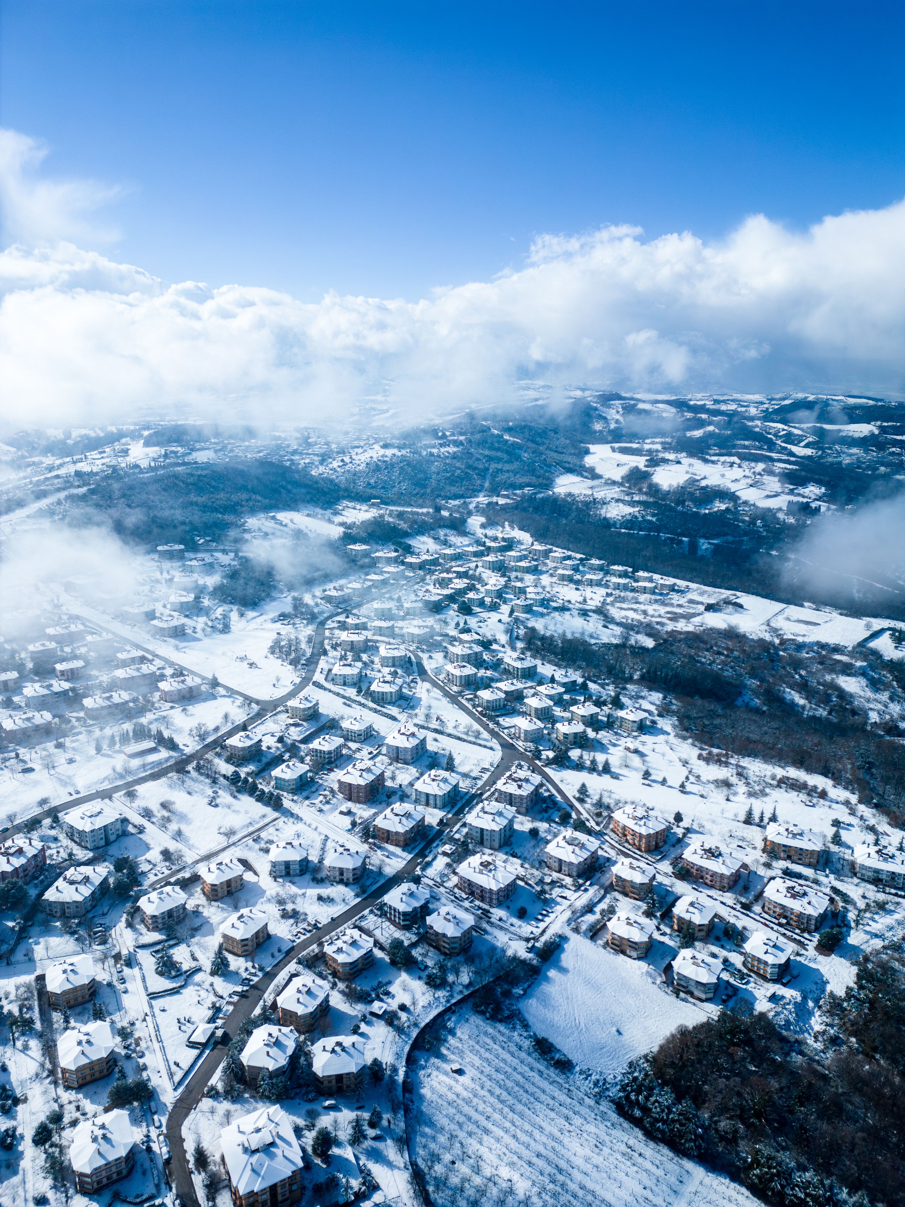 A breathtaking aerial view of Yalova, Türkiye blanketed in snow, showcasing a serene winter landscape.