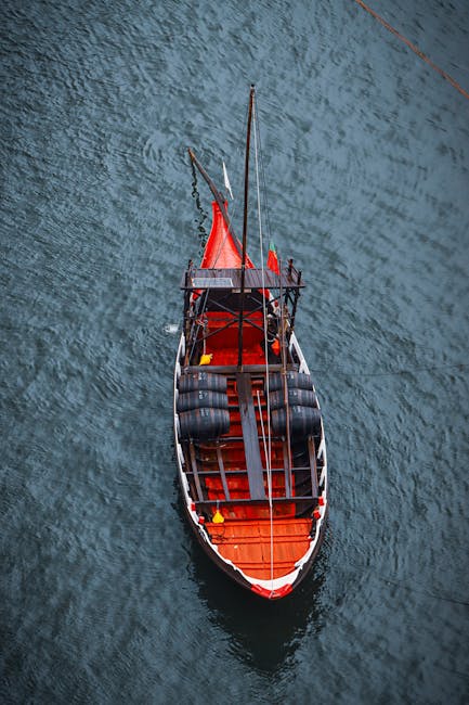 Aerial view of a traditional Portuguese boat on the Douro River in Porto, Portugal.