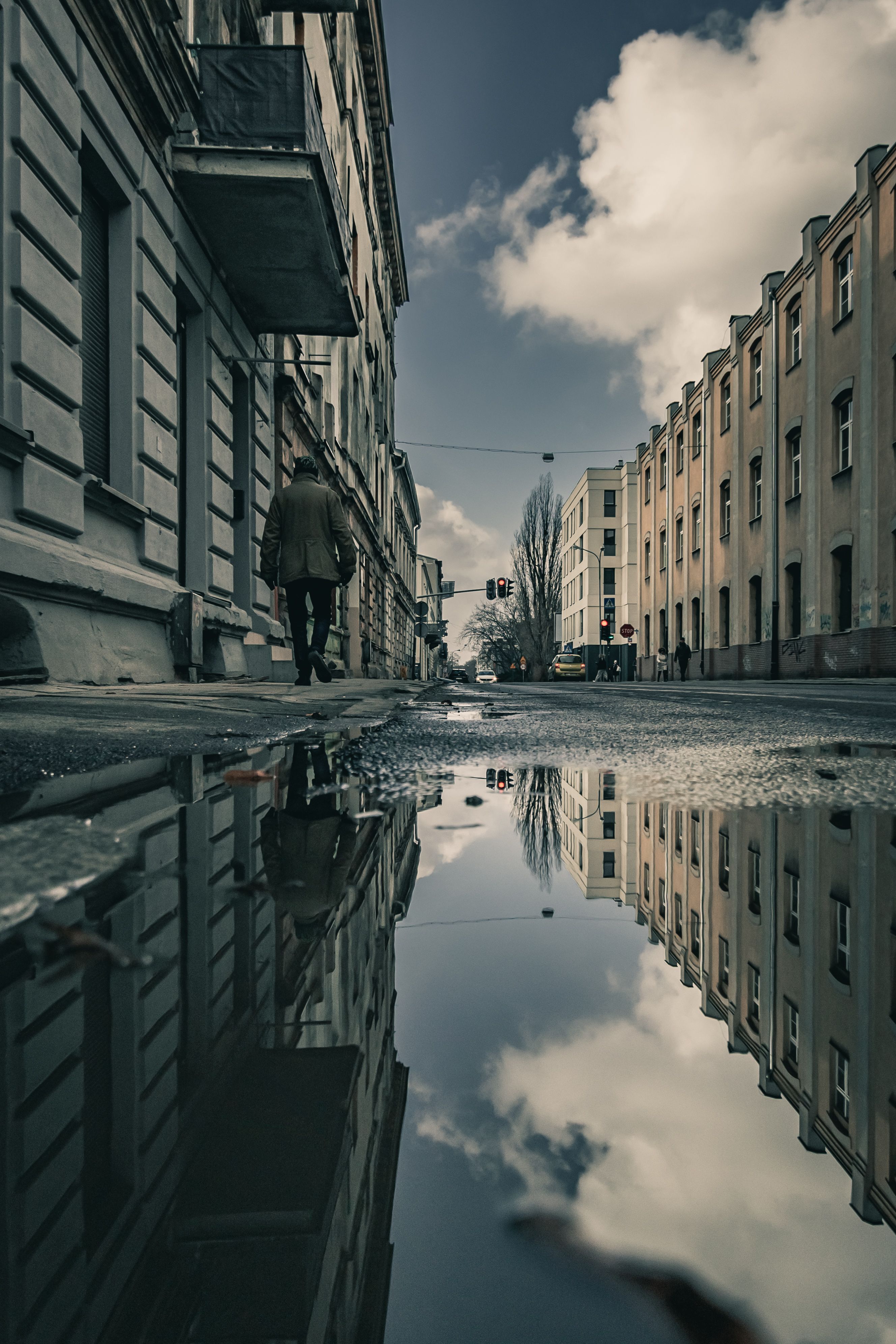 Puddle Reflection in Urban Street at Twilight · Free Stock Photo