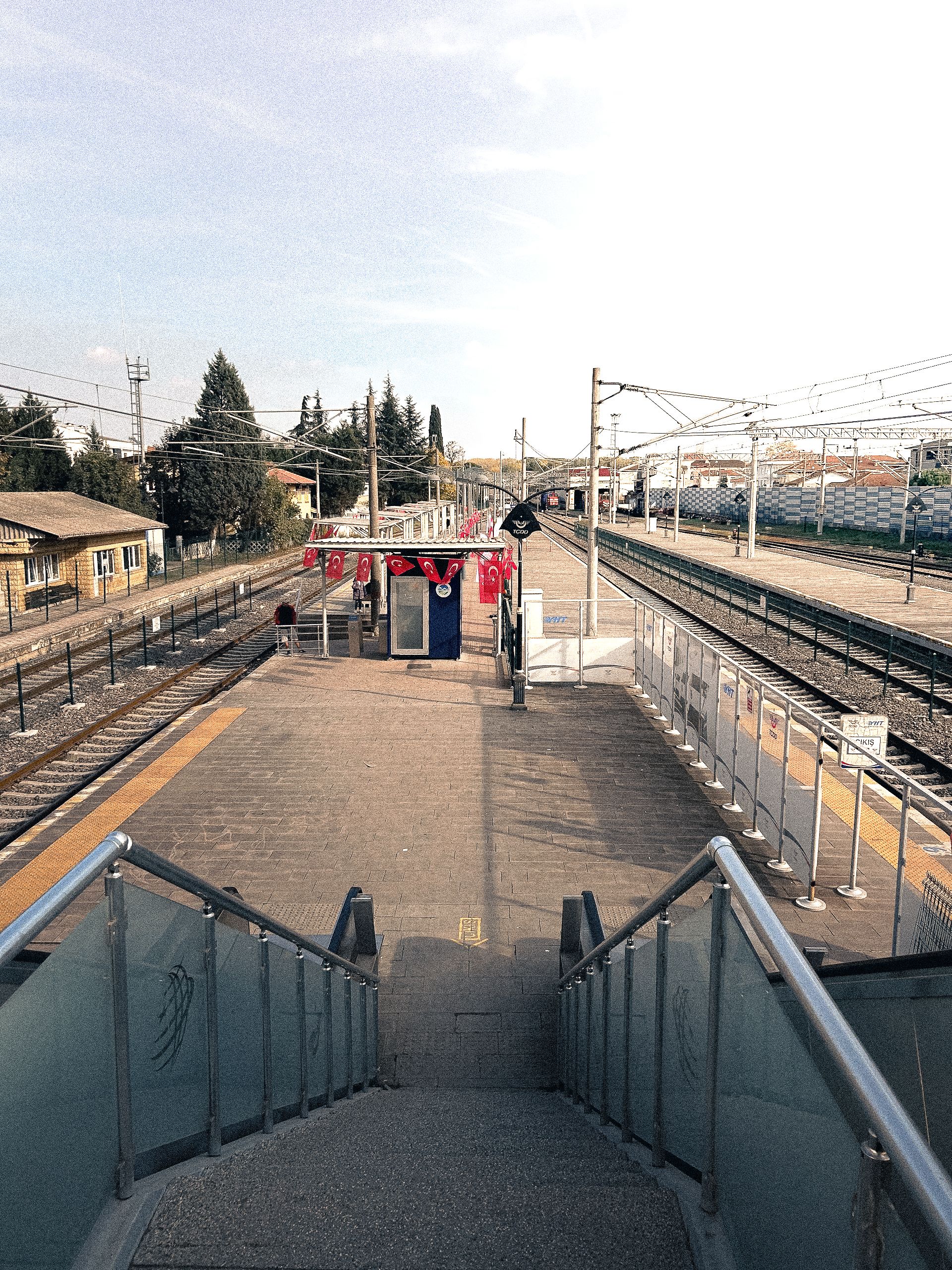 Empty train station platform in Sakarya, Türkiye, showcasing transportation infrastructure.