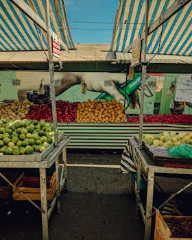 Vibrant market stall with fresh fruits and vegetables in São Paulo, Brazil.