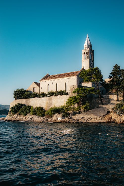 Free Picturesque view of a historic church on Lopud Island by the Adriatic Sea. Stock Photo