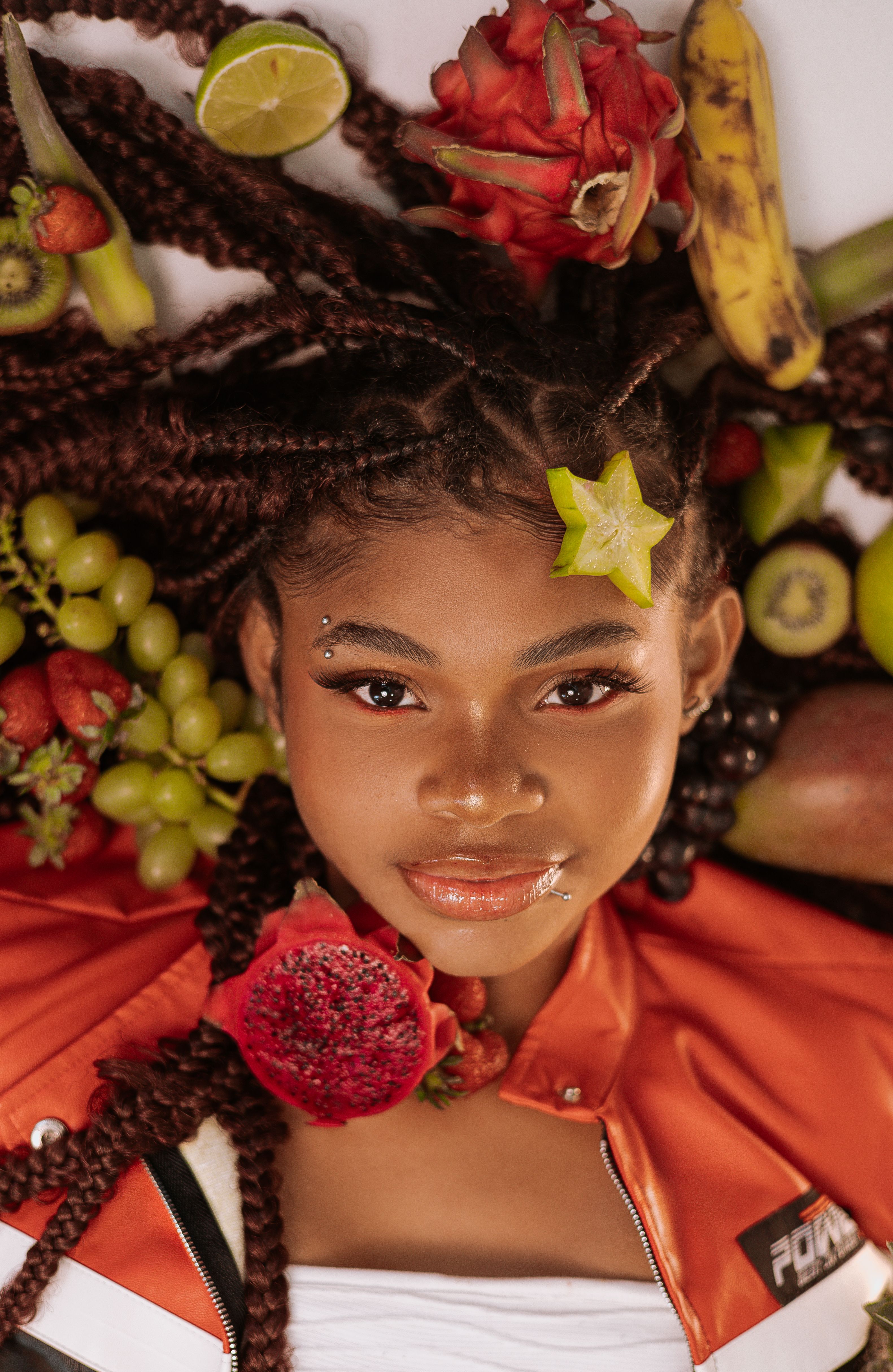 Woman Posing With Assorted Tropical Fruits · Free Stock Photo