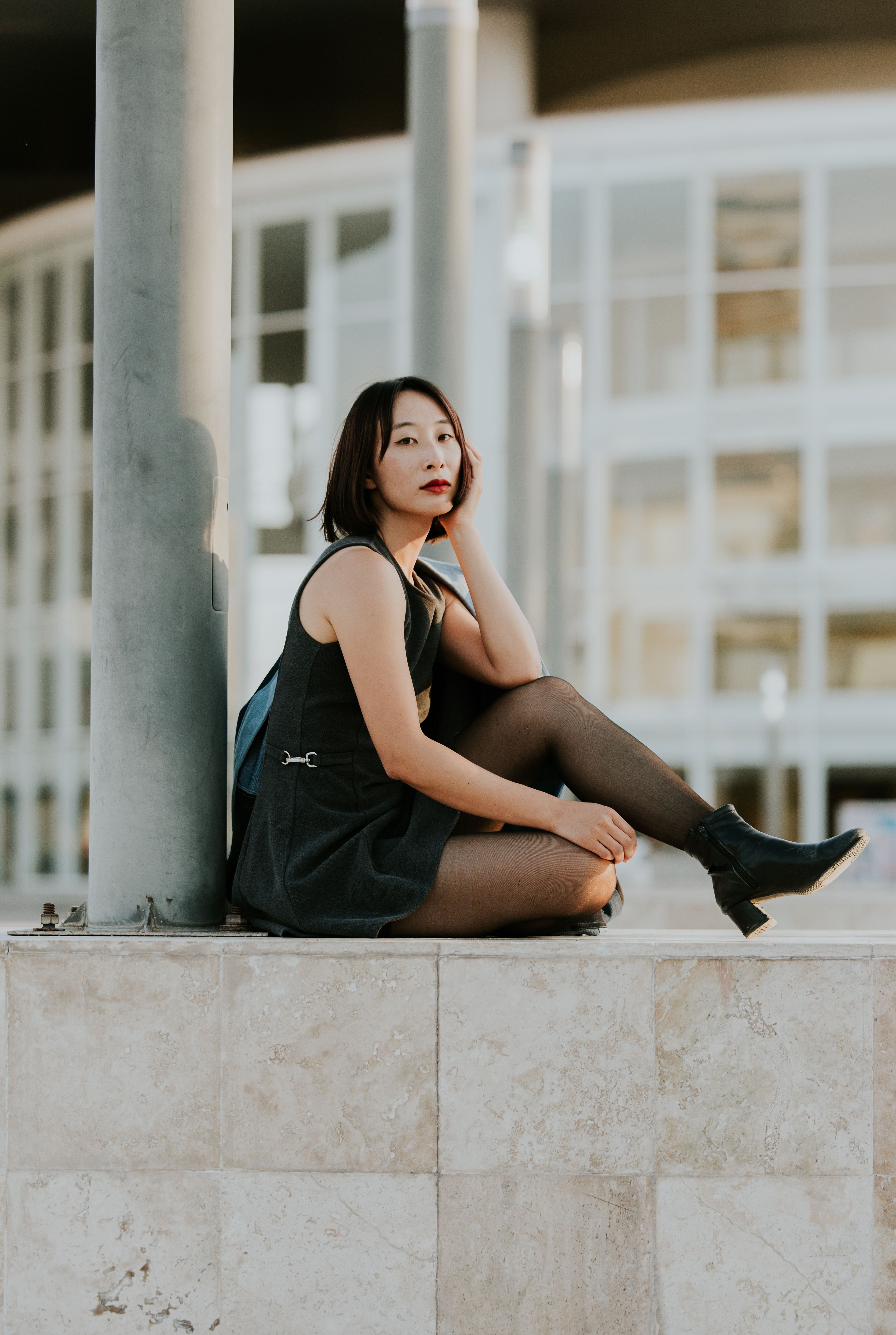 Stylish Woman Posing Outdoors in Urban Setting · Free Stock Photo