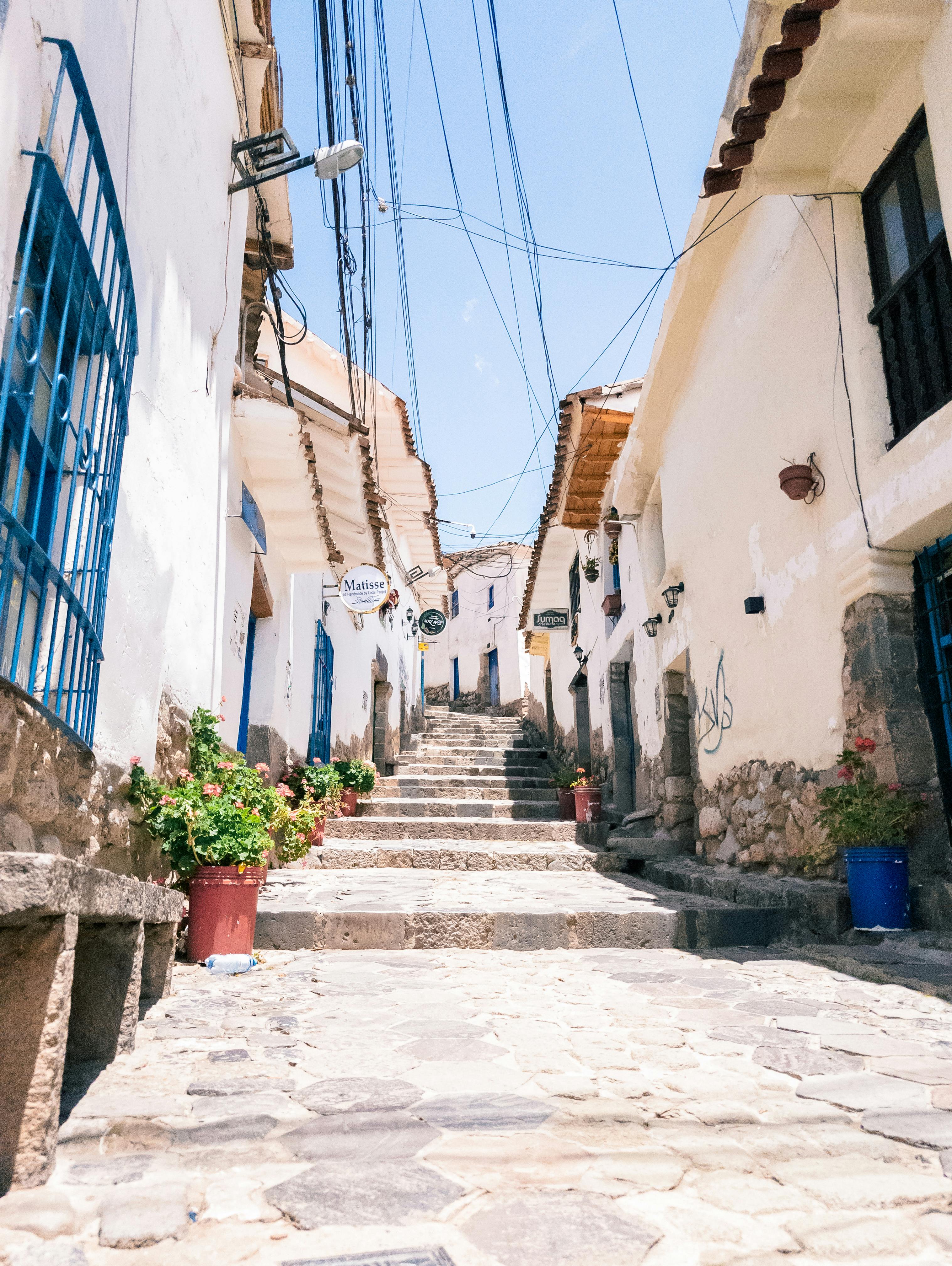 charming cusco street with whitewashed houses