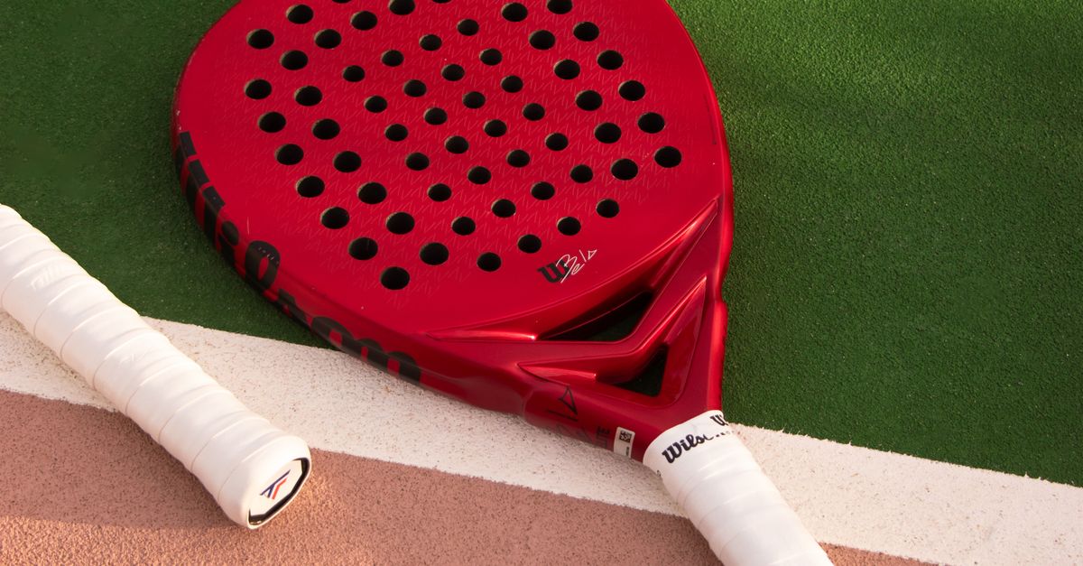 Redpadel Racket Red Padel Racket on Outdoor Court Surface · Free Stock Photo