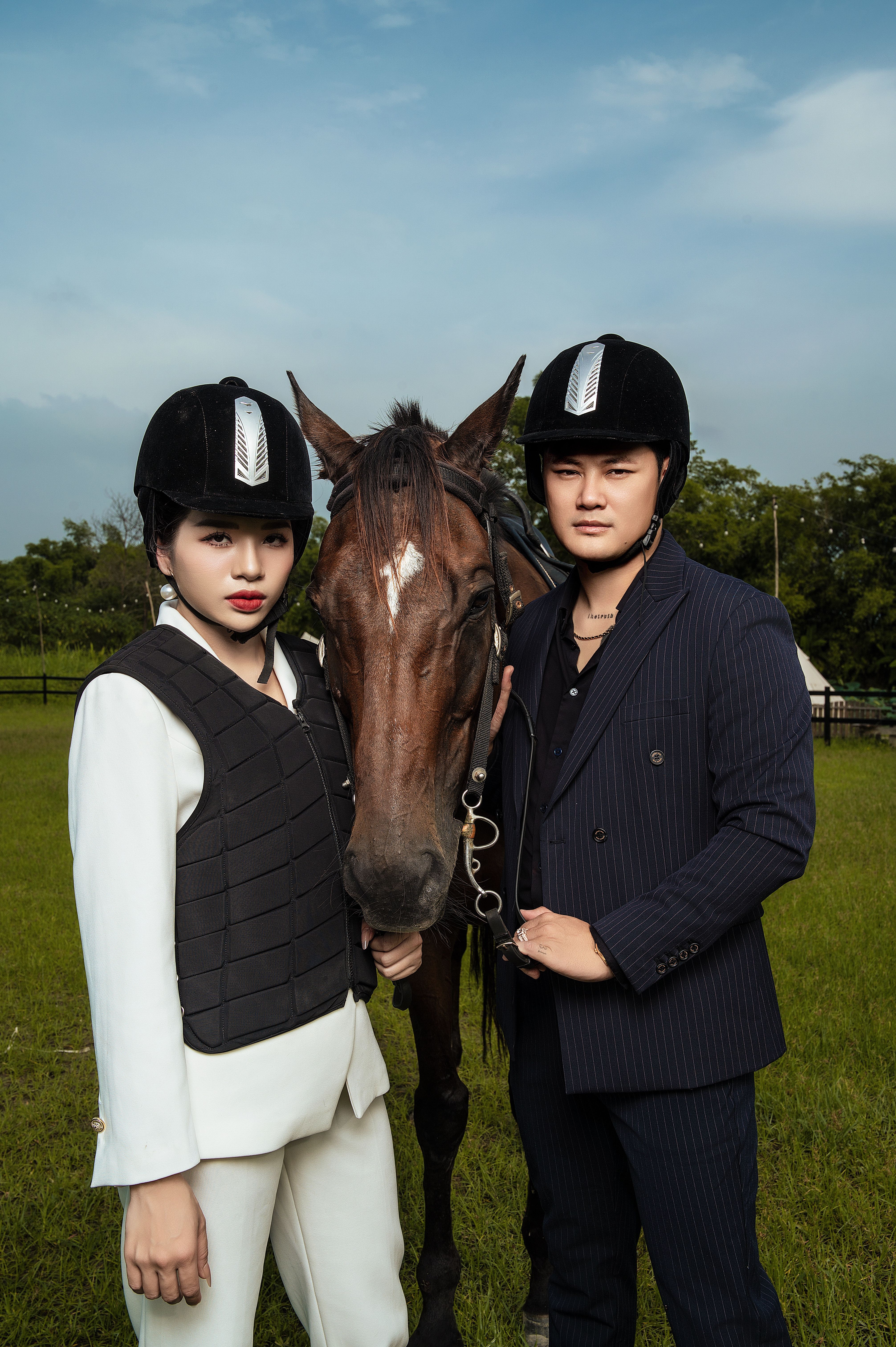 Equestrian Duo with Horse in Riding Attire Outdoors · Free Stock Photo