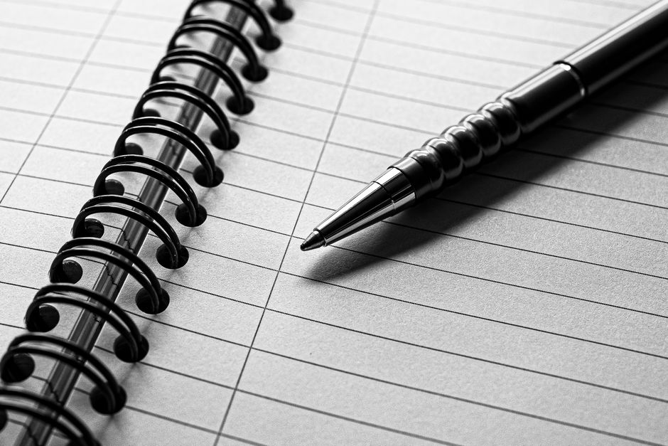 notebook and pen on desk natural light lifestyle photo 2