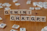 Scrabble Tiles Spelling Gemini and ChatGPT