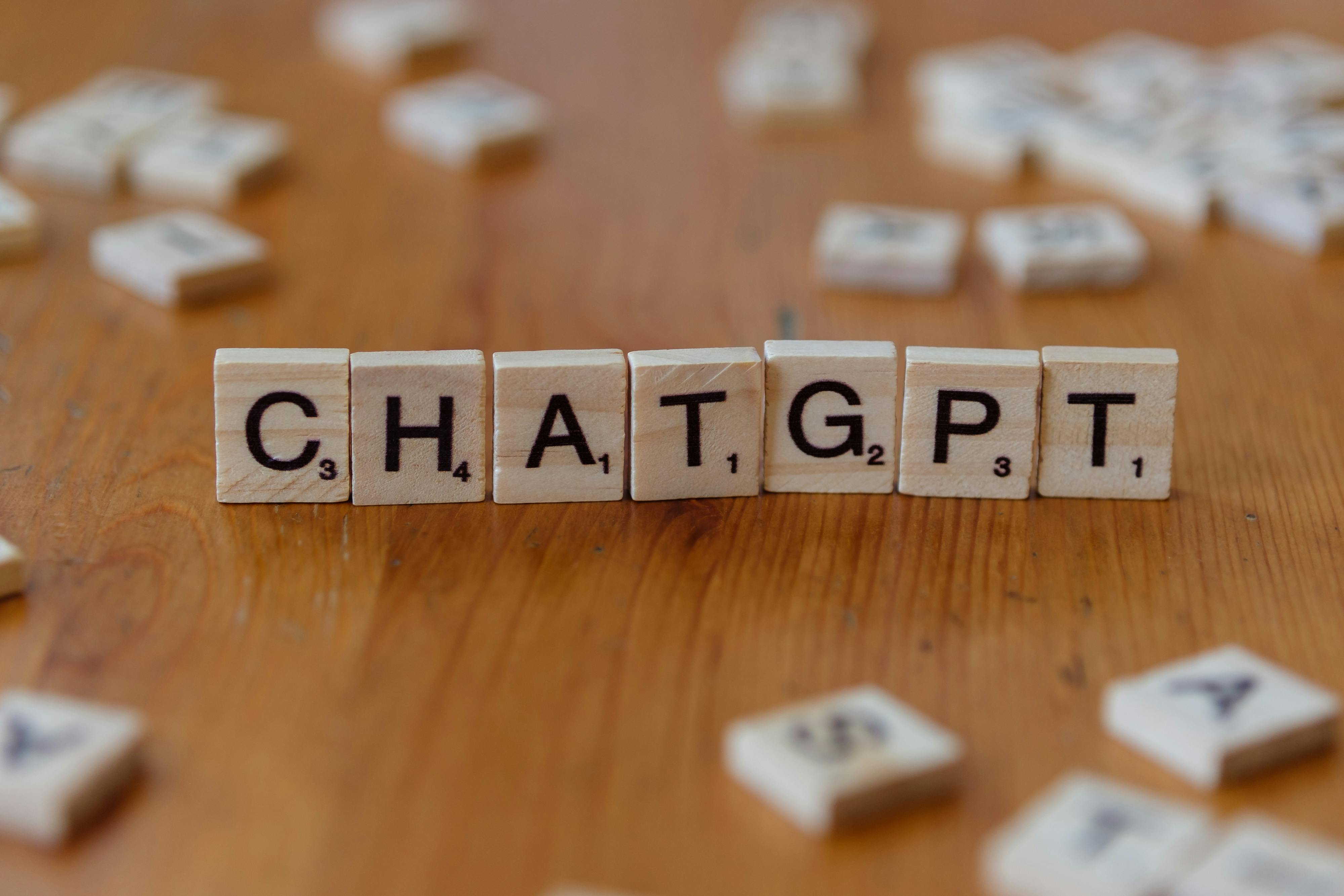 chatgpt spelled with wooden letter tiles on table