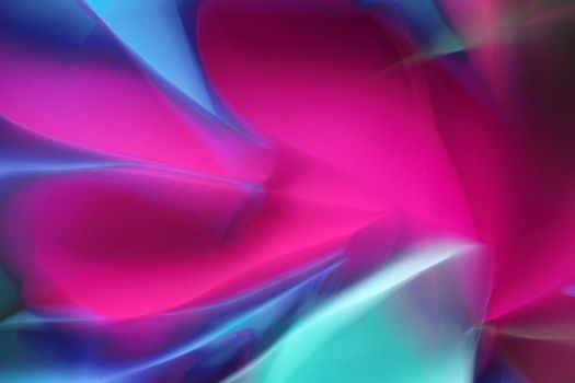 Colorful abstract wave pattern with vivid pinks and blues, creating a dynamic and fluid visual.