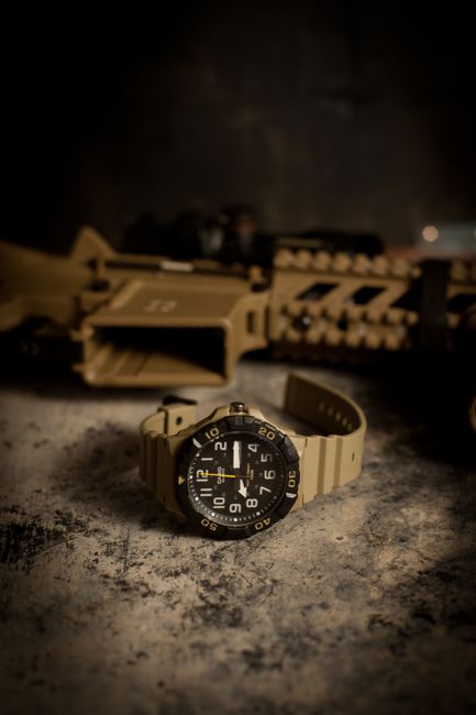 Group of U.S. Veterans attending a watch meetup, sharing stories and displaying their diverse collections of military and tactical timepieces