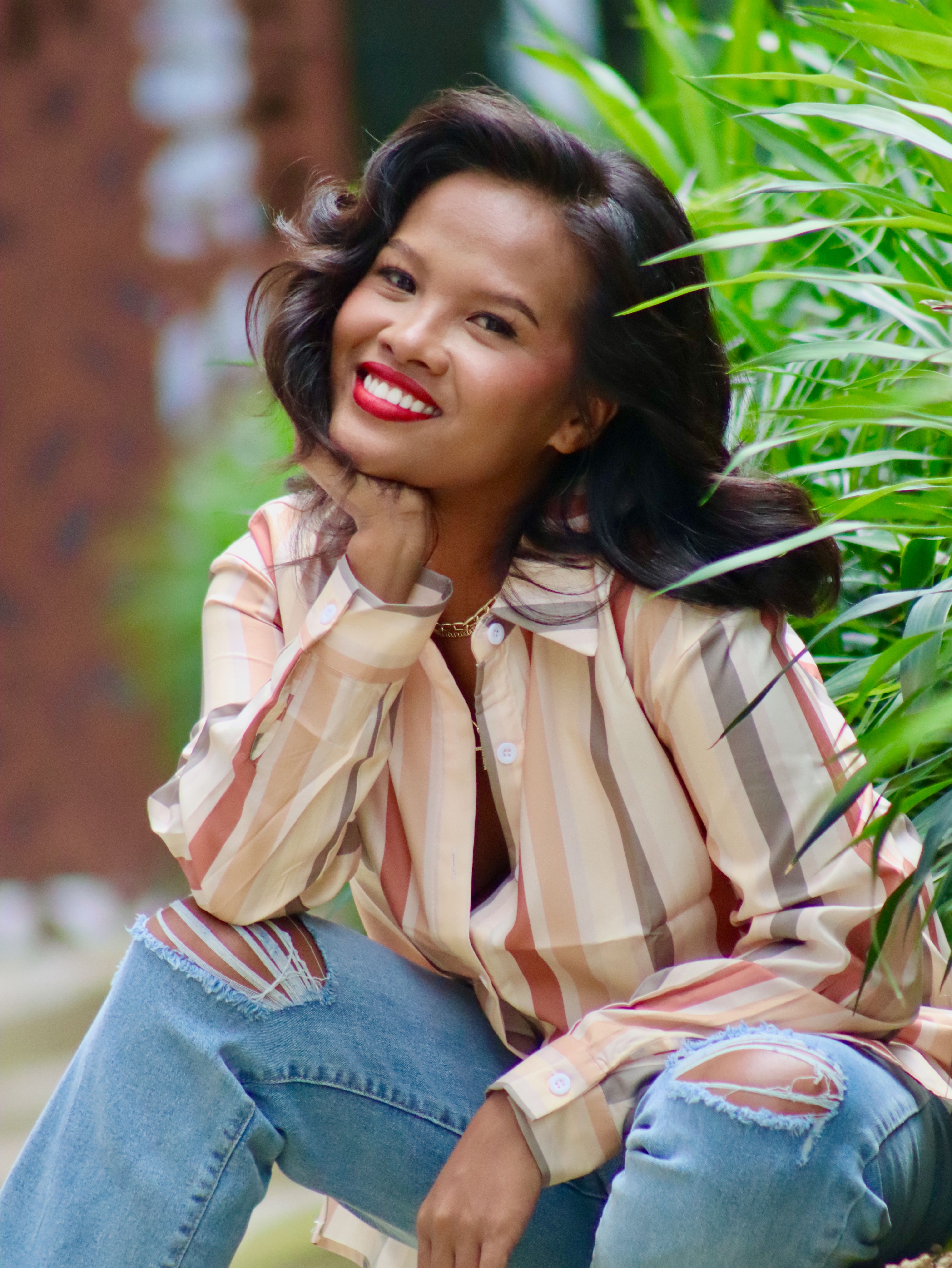 Smiling Woman in Striped Shirt Outdoors · Free Stock Photo