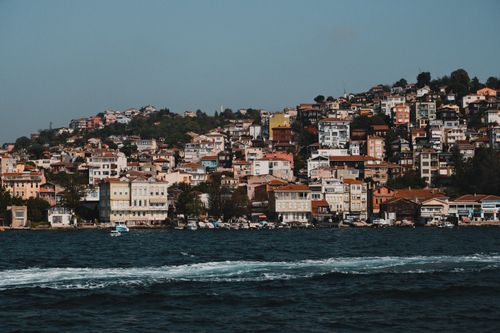 Free Charming view of Istanbul's vibrant hillside architecture by the Bosphorus coast. Stock Photo