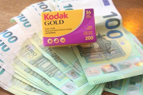 Free Close-up of Kodak Gold film box placed on 100 euro banknotes. Stock Photo