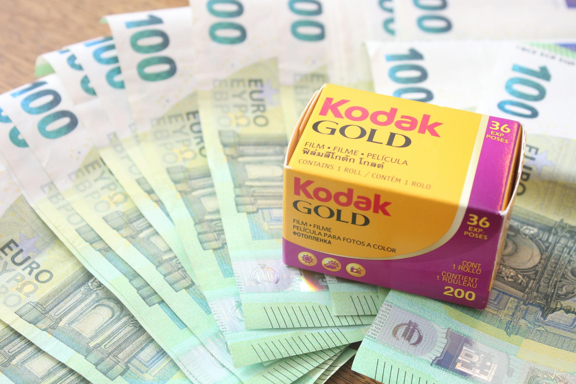 Kodak Gold 200 film box on a spread of Euro banknotes, symbolizing the value of photography.