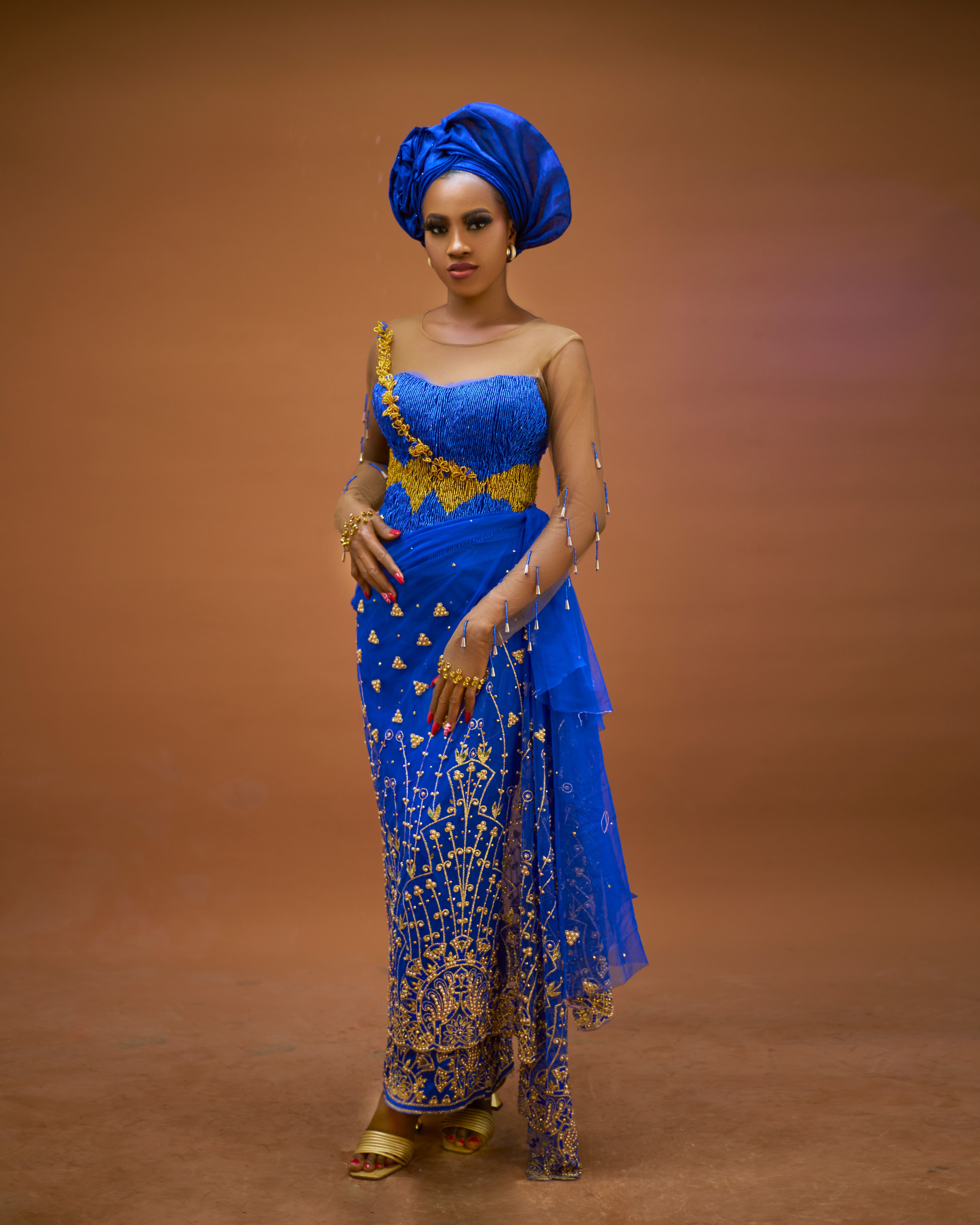 Elegant Woman in Traditional Blue African Attire  Free Stock Photo