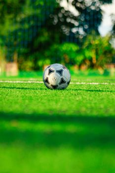 Close-up of a soccer ball on a lush green field in Acrelândia, Brazil.