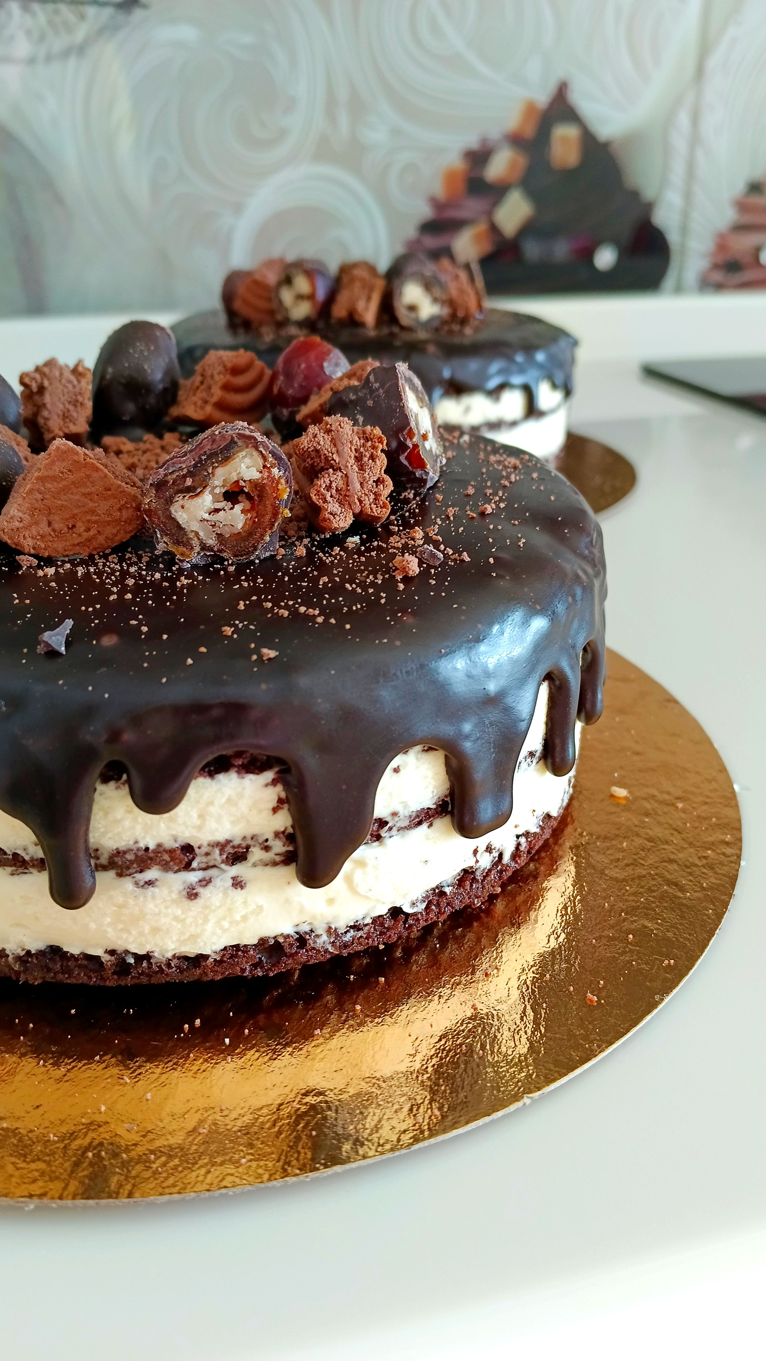Indulge in this delicious double chocolate cake topped with rich ganache and adorned with truffles.