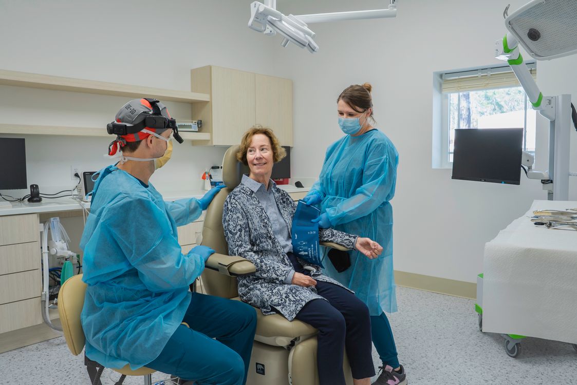 Dental team discussing care with a patient