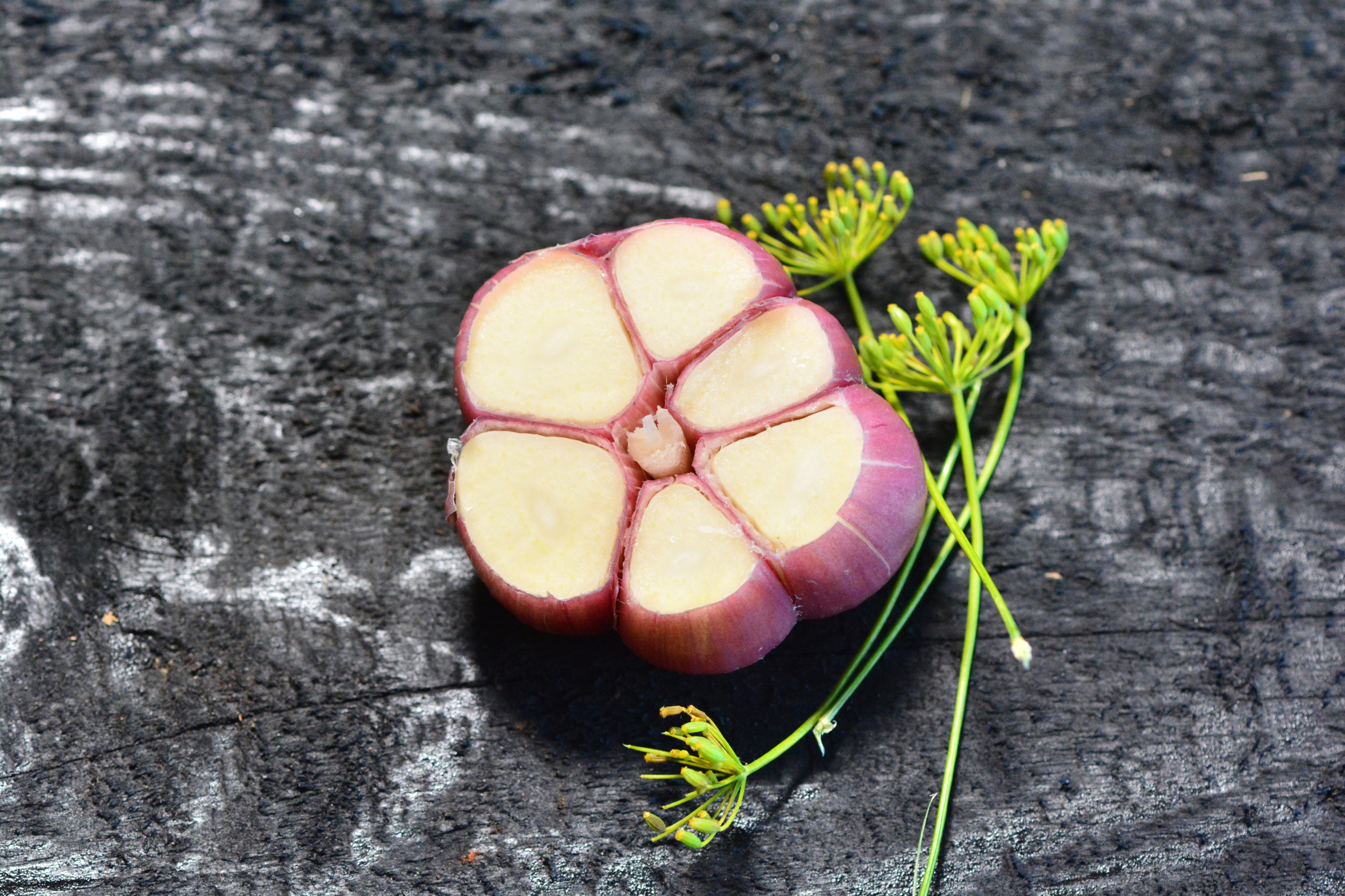 Close-up of Garlic Bulb on Rustic Surface · Free Stock Photo