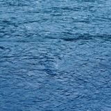 Now playing artwork — blue water surface by Benjamin Santiago on Pexels