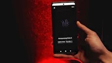 Hand Holding Smartphone with Grok 3 Announcement