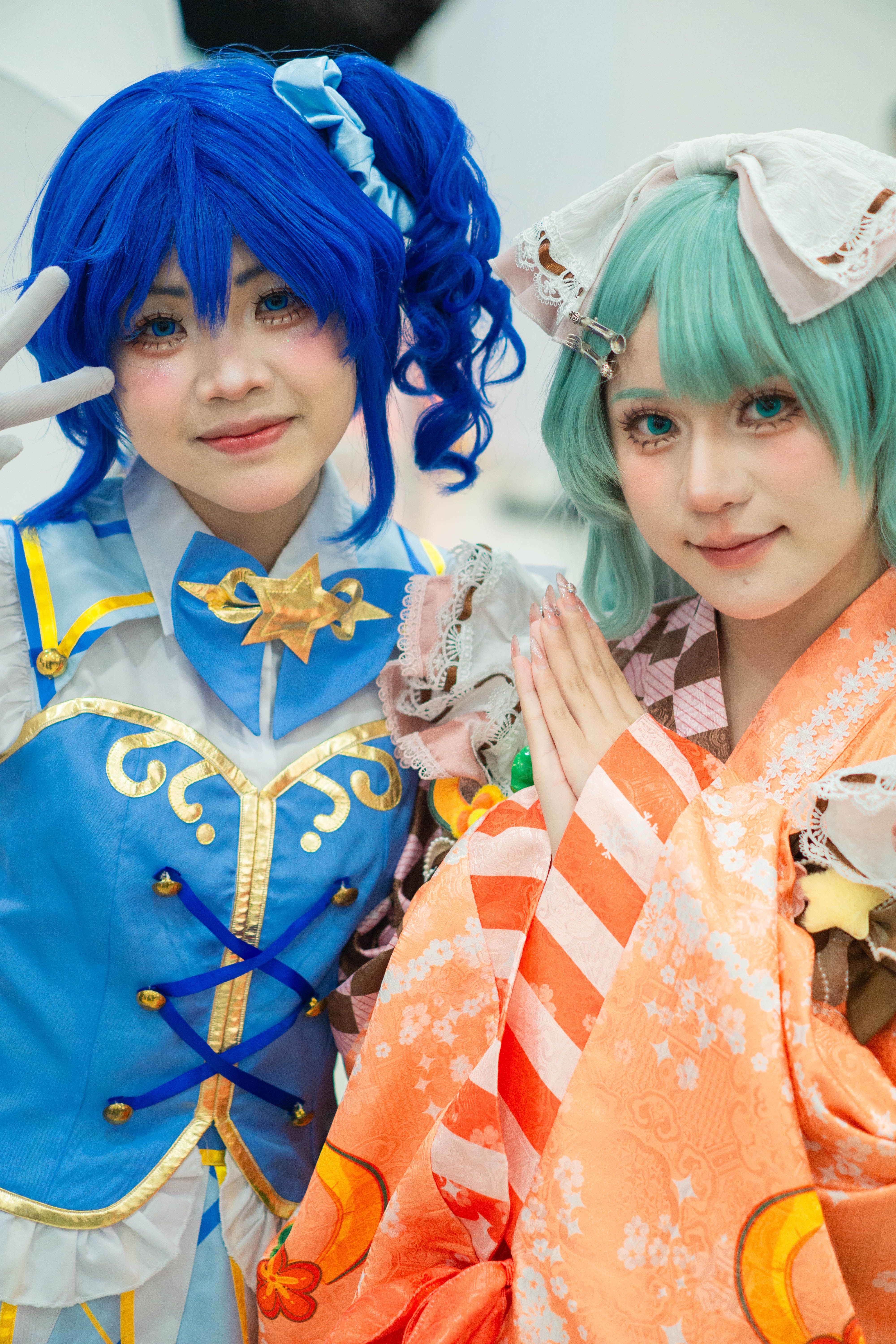 Colorful Anime Cosplay Duo at Convention