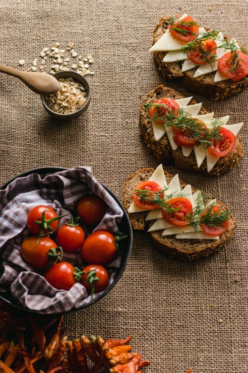 Free Delicious multi-grain bread with cheese, tomatoes, and dill. Perfect for a healthy snack. Stock Photo