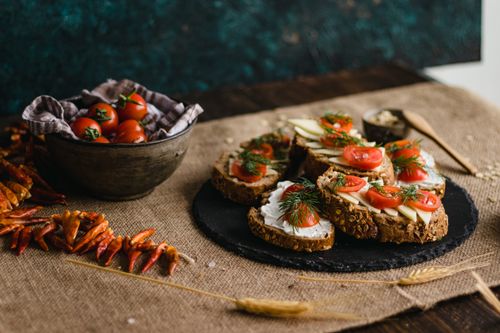Free A rustic composition of multigrain bread topped with feta, tomatoes, and dill in Istanbul. Stock Photo