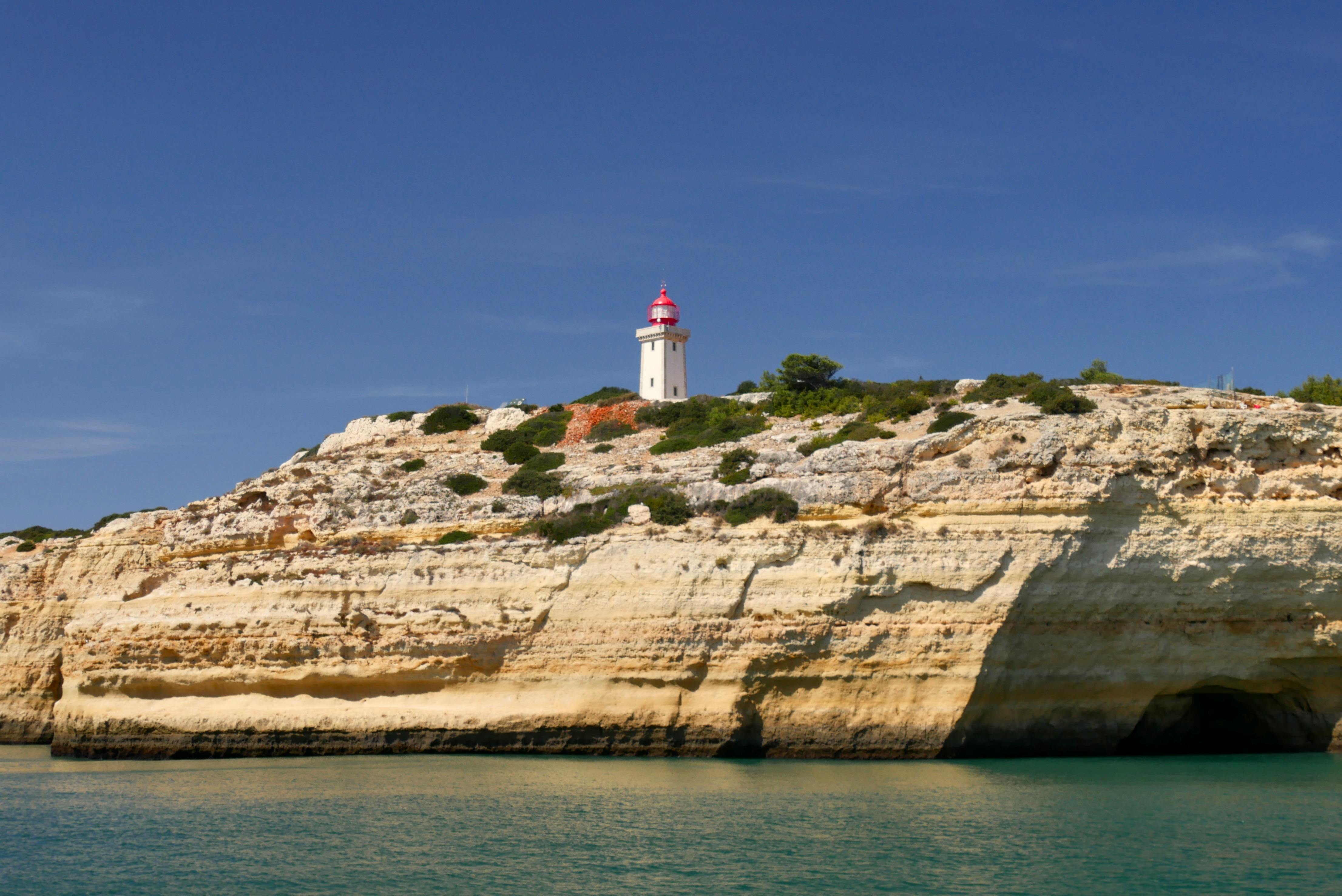 scenic algarve lighthouse perched on cliffs