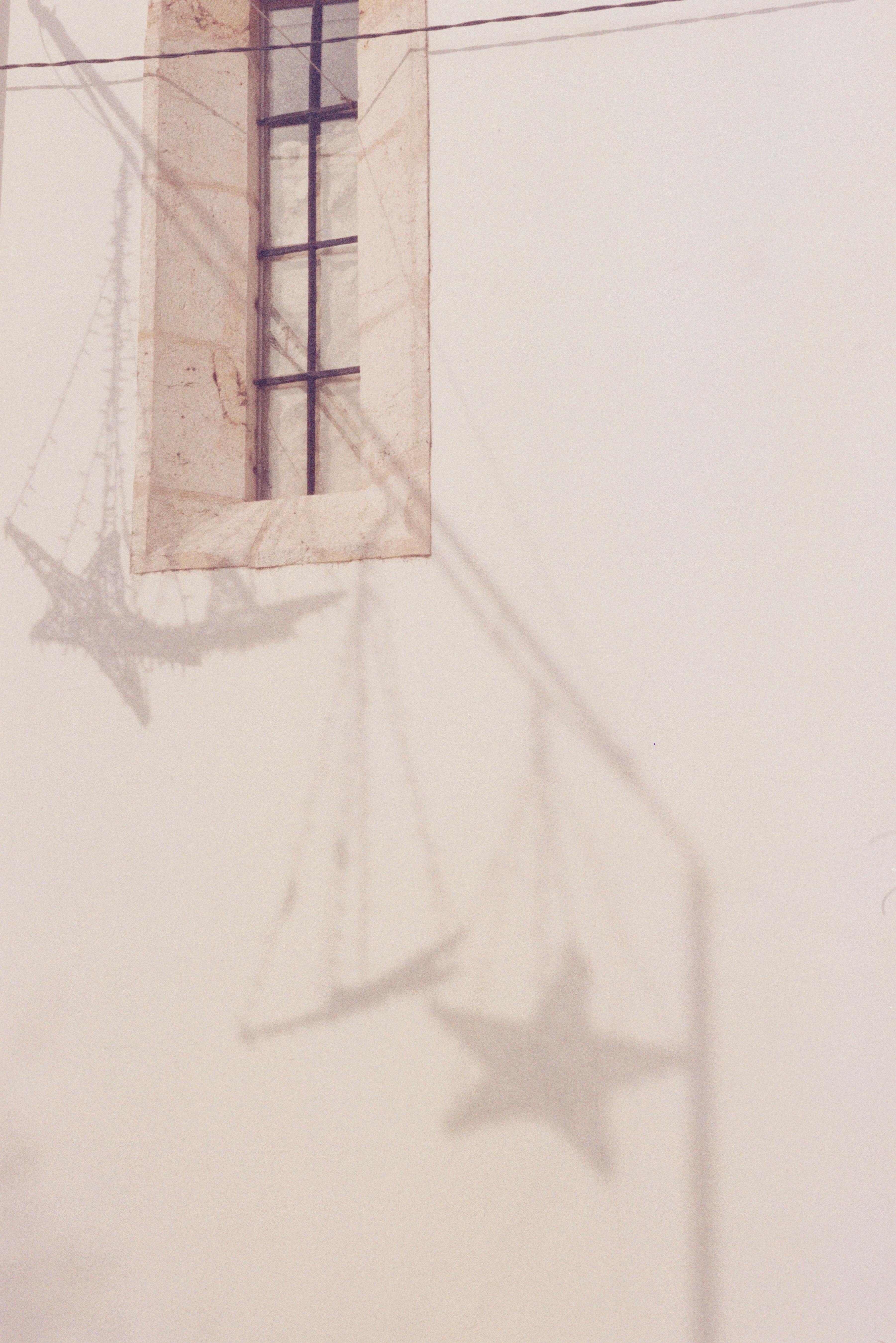 Free Artistic shadows of stars on a wall in Alcácer do Sal, Portugal. Stock Photo