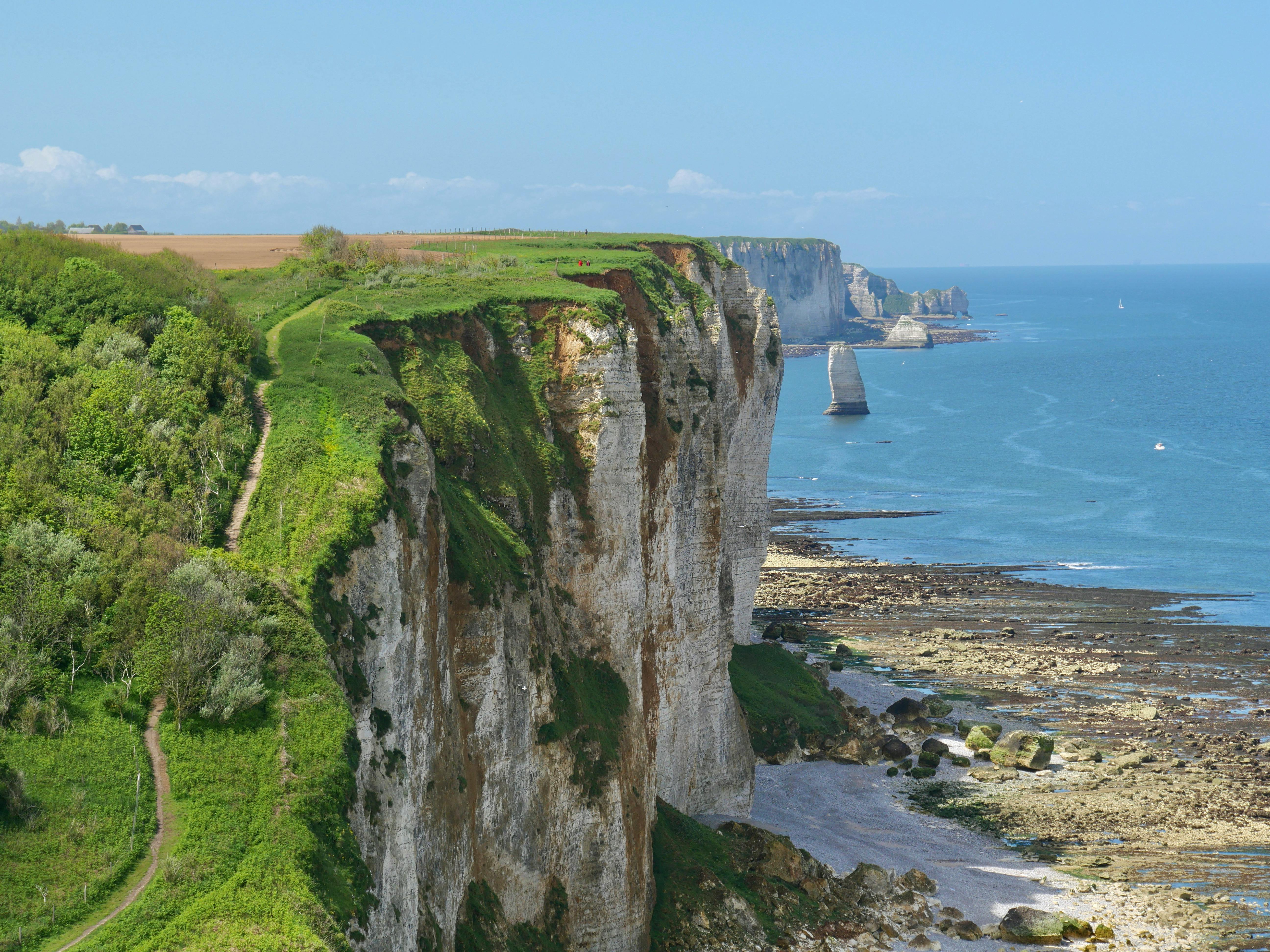Breathtaking view of the chalk cliffs and coastline at Etretat, France, ideal for nature and travel enthusiasts.