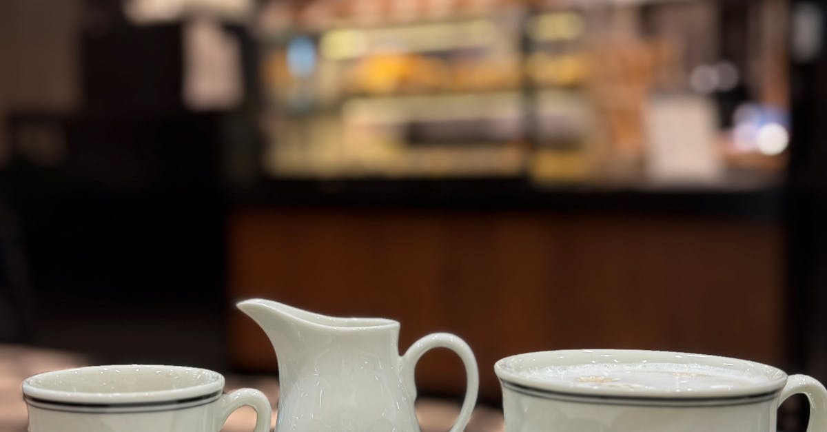 Elegant coffee set with logo on table at cozy café. Perfect setting for a warm beverage.