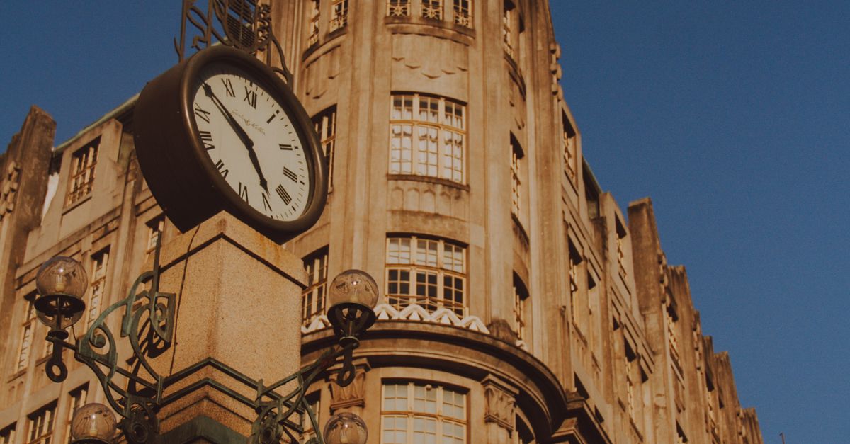 Clock Tower Color Designs Grand Clock Tower with Vintage Architectural Design · Free Stock Photo
