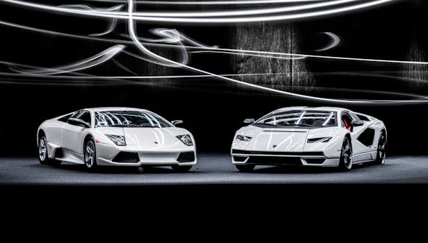 Elegant white Lamborghini Murcielago and Countach showcased with dynamic studio lighting.
