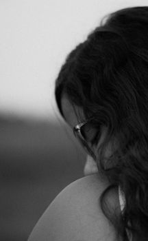 Elegant close-up black and white portrait capturing a thoughtful mood.