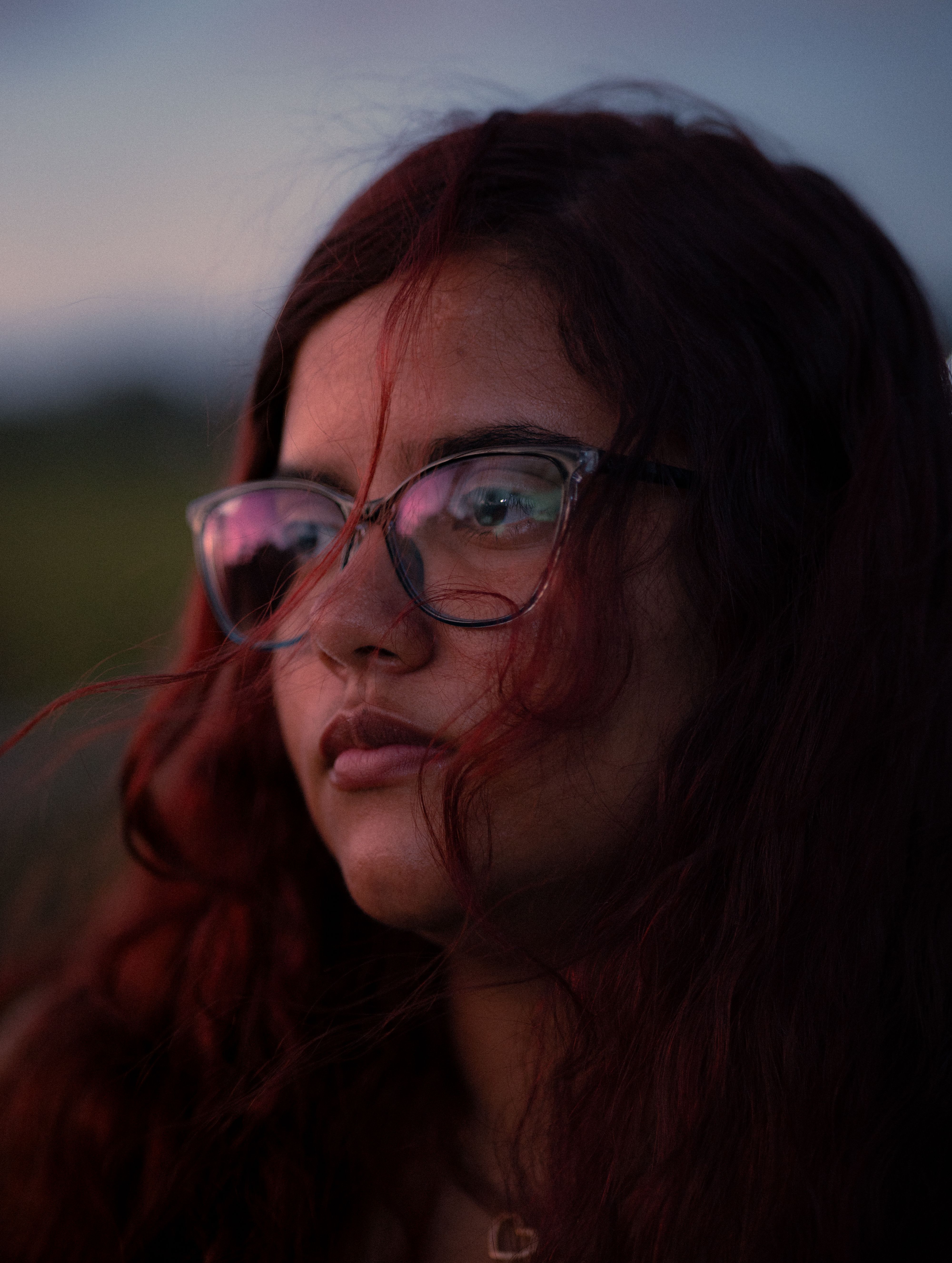 Portrait of Woman with Curly Red Hair and Glasses Outdoors · Free Stock ...