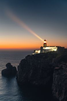 Stunning view of Cape St Vincent lighthouse at sunset in Algarve, Portugal.