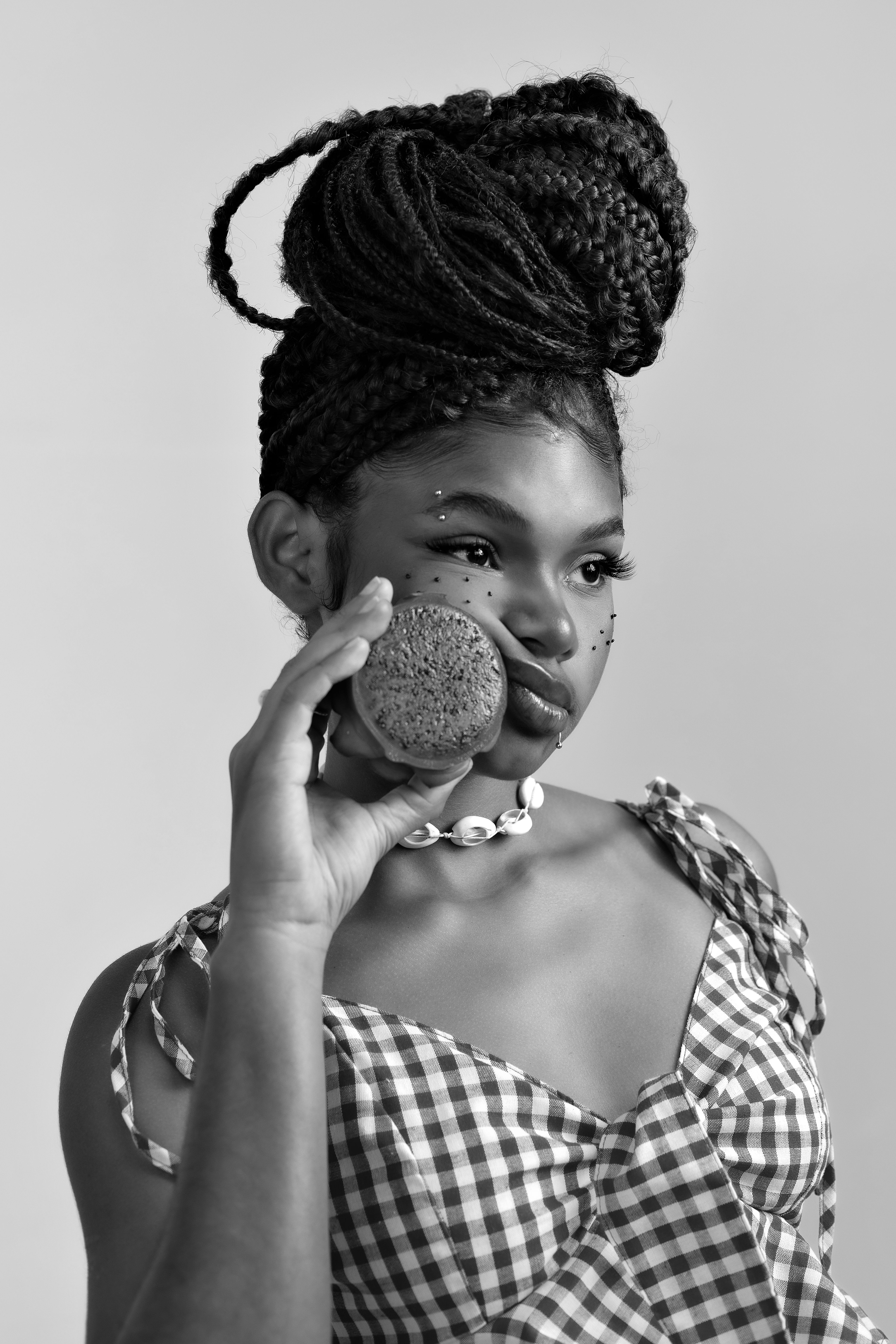 Portrait of a Young Woman with Afro Braids and Coconut · Free Stock Photo