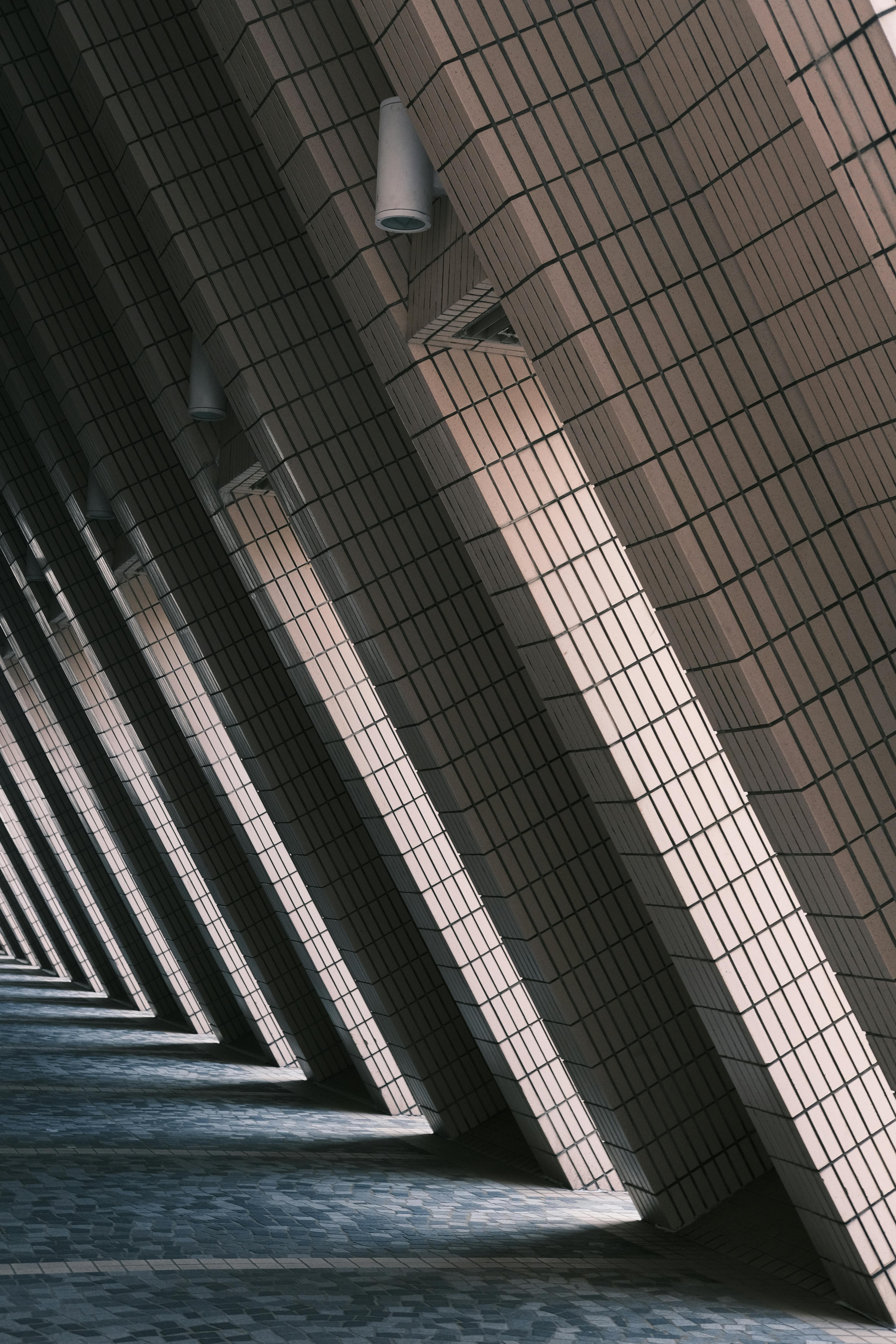 geometric architectural patterns in shadowed hallway