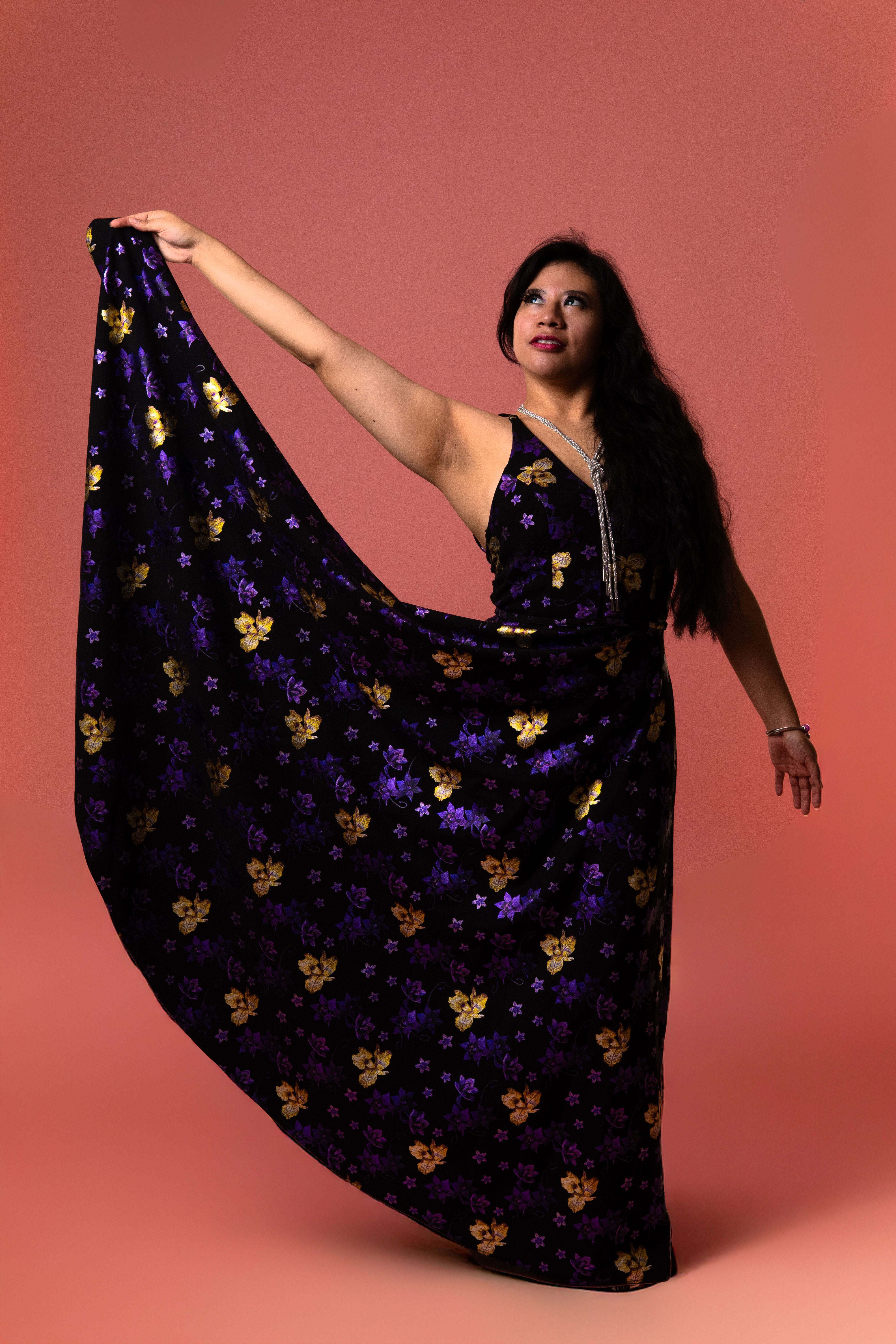 Elegant Woman in Floral Dress Posing Gracefully · Free Stock Photo